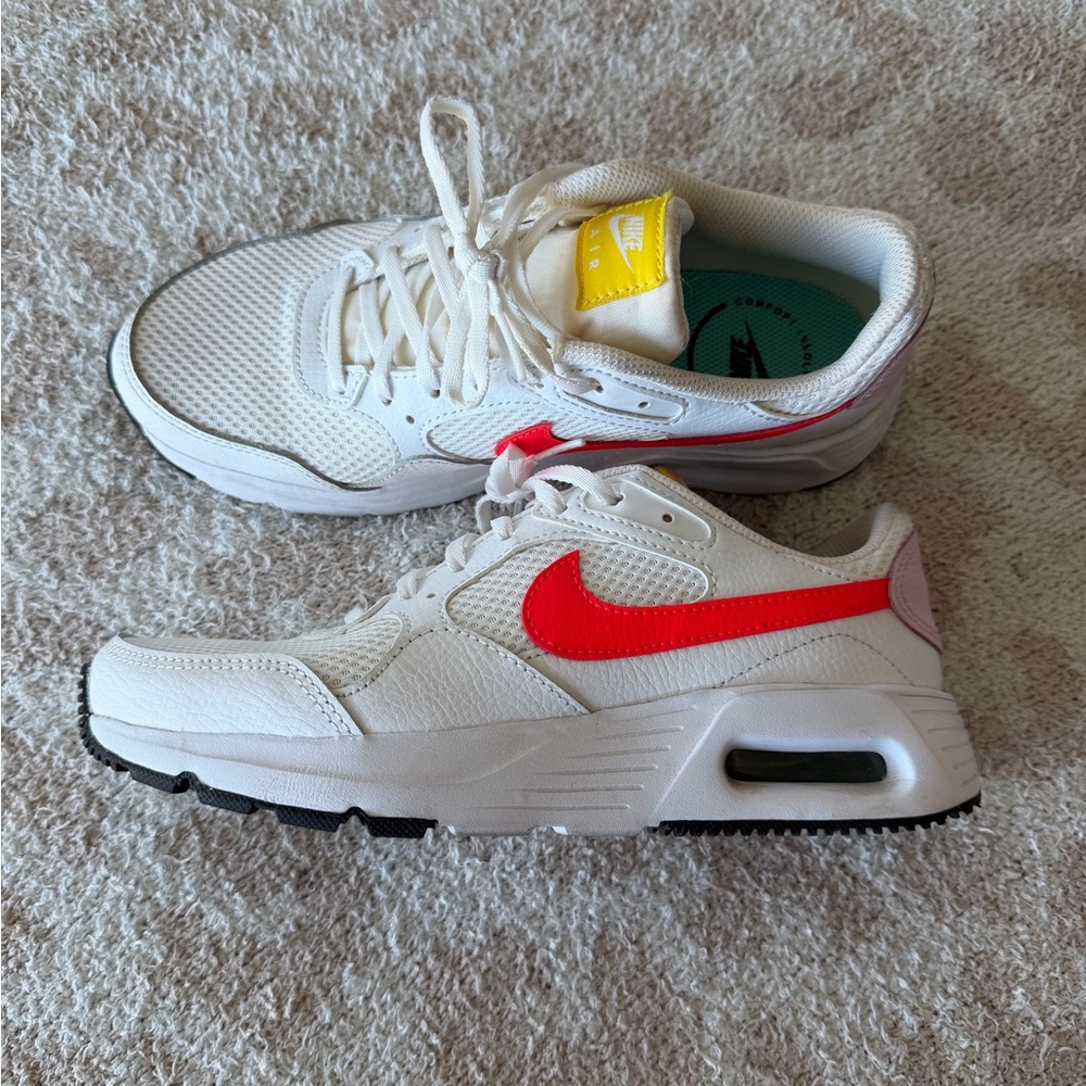 Nike women’s  White and Red Sneakers with Yellow Accent